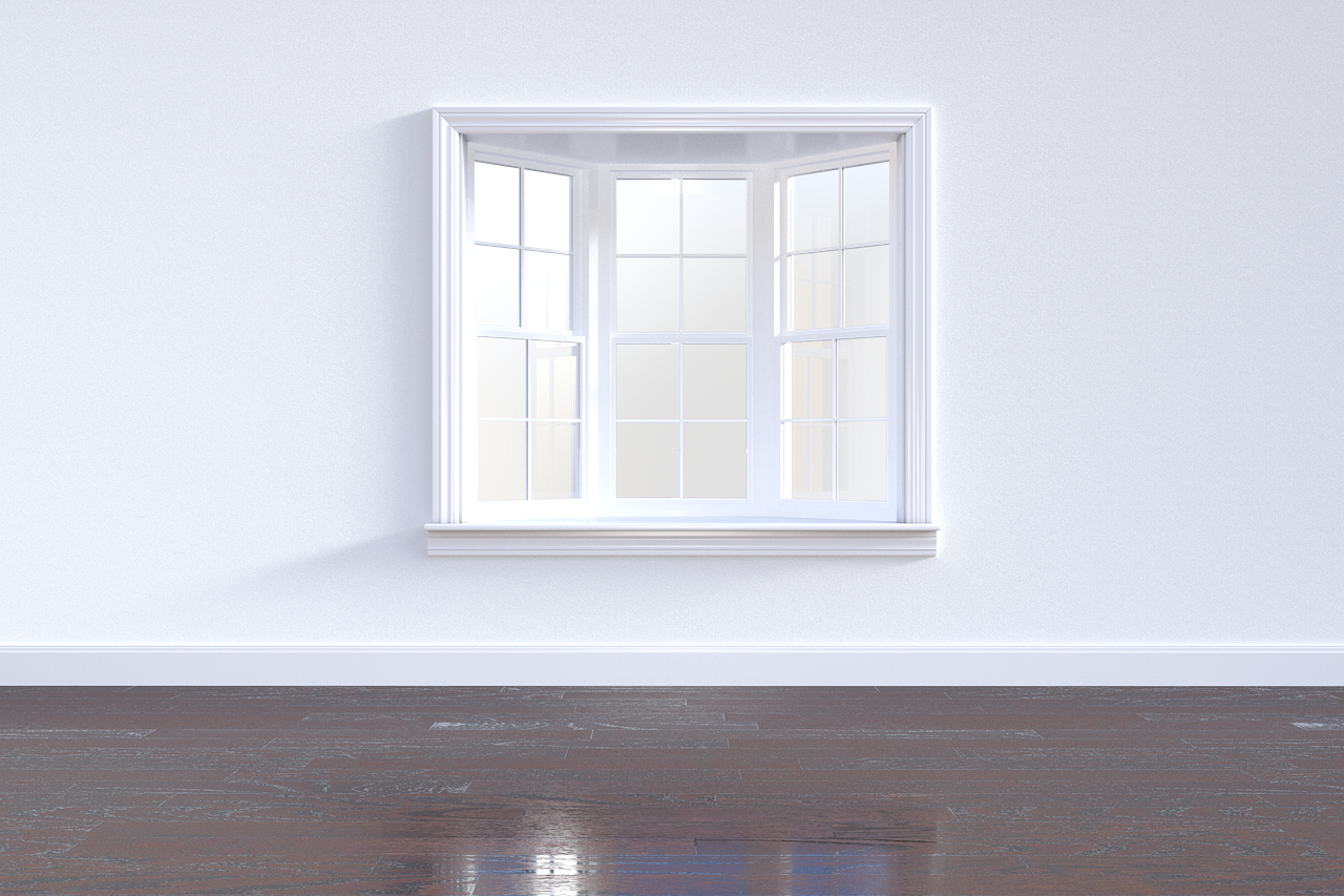 White-framed window on a freshly painted wall